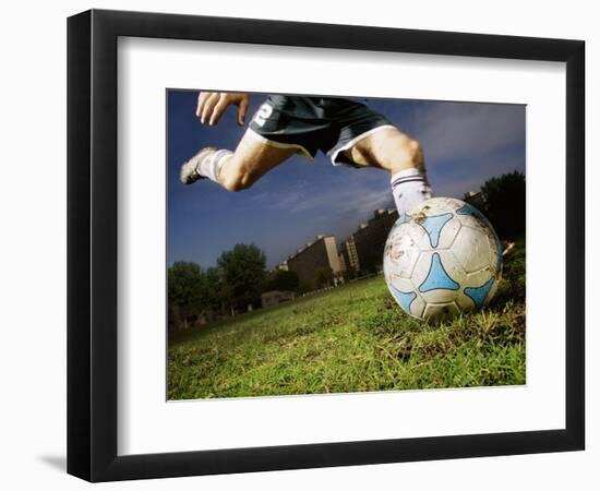 Soccer Player Kicking Ball-Randy Faris-Framed Photographic Print