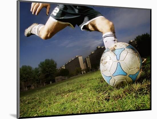 Soccer Player Kicking Ball-Randy Faris-Mounted Photographic Print