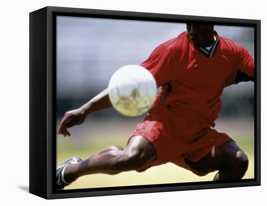 Soccer Player Preparing to Kick Ball-null-Framed Stretched Canvas