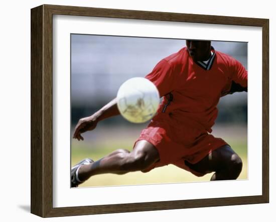 Soccer Player Preparing to Kick Ball-null-Framed Photographic Print