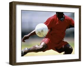 Soccer Player Preparing to Kick Ball-null-Framed Photographic Print