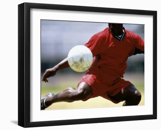 Soccer Player Preparing to Kick Ball-null-Framed Photographic Print