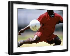 Soccer Player Preparing to Kick Ball-null-Framed Photographic Print