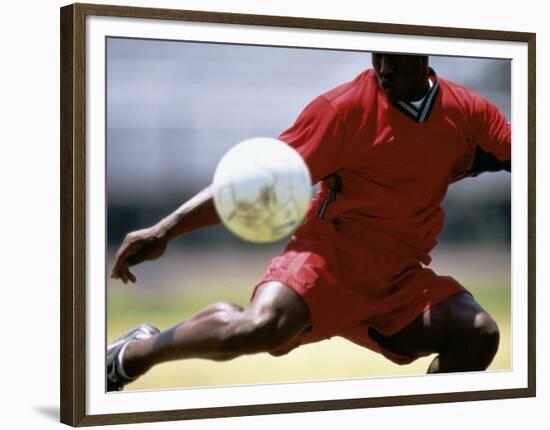 Soccer Player Preparing to Kick Ball-null-Framed Photographic Print
