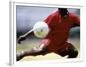 Soccer Player Preparing to Kick Ball-null-Framed Photographic Print