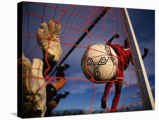 Soccer Player Scoring a Goal-null-Stretched Canvas
