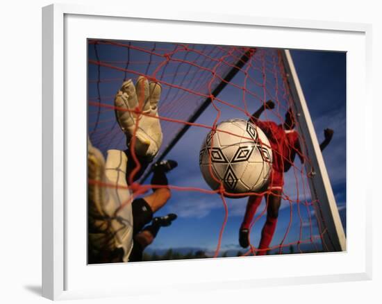 Soccer Player Scoring a Goal-null-Framed Photographic Print