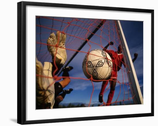 Soccer Player Scoring a Goal-null-Framed Photographic Print