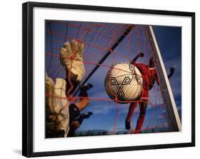 Soccer Player Scoring a Goal-null-Framed Photographic Print