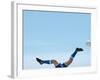 Soccer player upside-down attempting to kick the ball-null-Framed Photographic Print