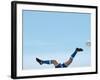 Soccer player upside-down attempting to kick the ball-null-Framed Photographic Print