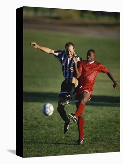 Soccer Players Fighting for the Ball-null-Stretched Canvas