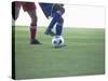 Soccer players from opposing teams compete for the ball during a game-null-Stretched Canvas