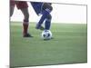 Soccer players from opposing teams compete for the ball during a game-null-Mounted Photographic Print