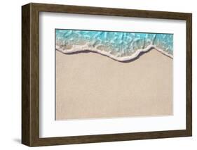 Soft Wave of Blue Ocean on Sandy Beach. Background. Selective Focus.-Lidiya Oleandra-Framed Photographic Print