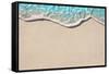 Soft Wave of Blue Ocean on Sandy Beach. Background. Selective Focus.-Lidiya Oleandra-Framed Stretched Canvas