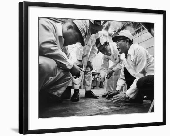 Soichiro Honda Showing Engineers Solution to Body Noise Problem at Research Facility, Japan, 1967-Takeyoshi Tanuma-Framed Photographic Print