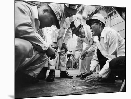 Soichiro Honda Showing Engineers Solution to Body Noise Problem at Research Facility, Japan, 1967-Takeyoshi Tanuma-Mounted Photographic Print