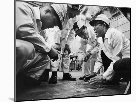 Soichiro Honda Showing Engineers Solution to Body Noise Problem at Research Facility, Japan, 1967-Takeyoshi Tanuma-Mounted Photographic Print