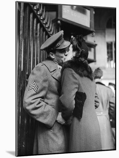 Soldier Kissing His Girlfriend While Saying Goodbye in Pennsylvania Station-Alfred Eisenstaedt-Mounted Photographic Print