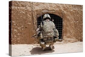 Soldier Searches a Compound in Afghanistan-null-Stretched Canvas