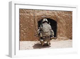 Soldier Searches a Compound in Afghanistan-null-Framed Photographic Print