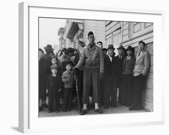 Soldier Standing Guard of Japanese American Citizens Awaiting Transport to Relocation Camps-Dorothea Lange-Framed Photographic Print