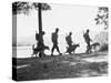 Soldiers and their Dogs Walking along the Shore-null-Stretched Canvas