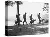 Soldiers and their Dogs Walking along the Shore-null-Stretched Canvas