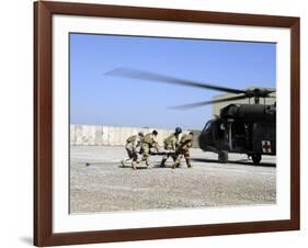 Soldiers Rush a Simulated Casualty to a UH-60 Blackhawk Helicopter-Stocktrek Images-Framed Photographic Print