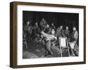 Songwriter Irving Berlin Reading Newspaper as Others Sit around Talking-null-Framed Photographic Print