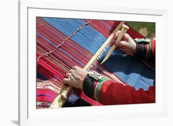 South America, Peru, Chinchero. Chinchero Cooperative weaver demonstrates using loom and tool.-Kymri Wilt-Framed Photographic Print