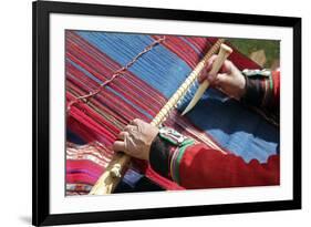 South America, Peru, Chinchero. Chinchero Cooperative weaver demonstrates using loom and tool.-Kymri Wilt-Framed Photographic Print