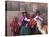 South America, Peru, Cusco. Quechua People in Front of An Inca Wall, Holding a Lamb and a Llama-Alex Robinson-Stretched Canvas