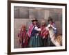 South America, Peru, Cusco. Quechua People in Front of An Inca Wall, Holding a Lamb and a Llama-Alex Robinson-Framed Photographic Print