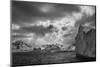 South Georgia Island. Black and white Landscape of iceberg floating and mountain scenery.-Howie Garber-Mounted Photographic Print