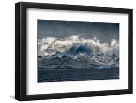 South Georgia Island. Opening in clouds and Virga reveal the mountainous and glaciated landscape.-Howie Garber-Framed Photographic Print