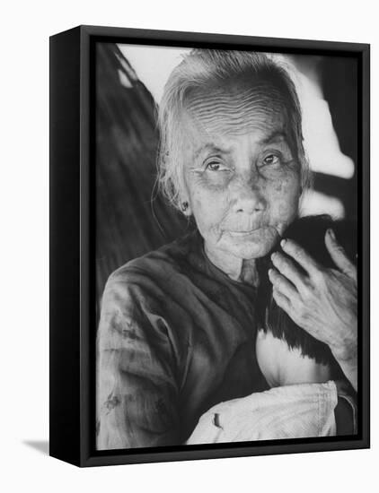 South Vietnamese Refugee Holding Small Child-Carl Mydans-Framed Stretched Canvas