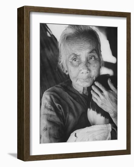 South Vietnamese Refugee Holding Small Child-Carl Mydans-Framed Photographic Print