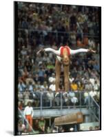 Soviet Gymnast Olga Korbut in Action on the Balance Beam at the Summer Olympics-John Dominis-Mounted Premium Photographic Print