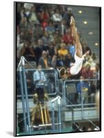 Soviet Gymnast Olga Korbut in Action on the Uneven Bars at the Summer Olympics-John Dominis-Mounted Premium Photographic Print