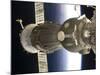 Soyuz Spacecraft Backdropped by Earth-null-Mounted Photographic Print