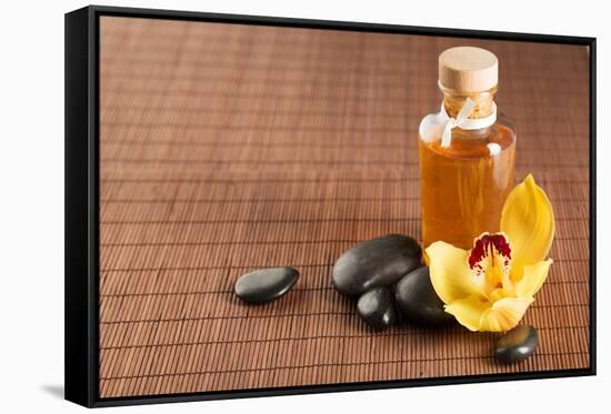 Spa, Health and Beauty Concept - Closeup of Essential Oil, Massage Stones and Orchid Flower-dolgachov-Framed Stretched Canvas