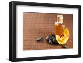 Spa, Health and Beauty Concept - Closeup of Essential Oil, Massage Stones and Orchid Flower-dolgachov-Framed Photographic Print