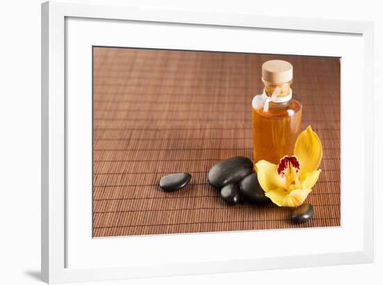 Spa, Health and Beauty Concept - Closeup of Essential Oil, Massage Stones and Orchid Flower-dolgachov-Framed Photographic Print