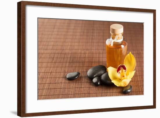 Spa, Health and Beauty Concept - Closeup of Essential Oil, Massage Stones and Orchid Flower-dolgachov-Framed Photographic Print