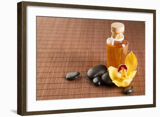 Spa, Health and Beauty Concept - Closeup of Essential Oil, Massage Stones and Orchid Flower-dolgachov-Framed Photographic Print