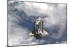 Space Shuttle Atlantis Above a Cloud Covered Earth-null-Mounted Photographic Print