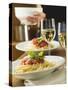Spaghetti Bolognese and White Wine for Two on Table-null-Stretched Canvas