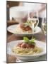 Spaghetti with Tomato Sauce and Glasses of White Wine on Table-null-Mounted Photographic Print